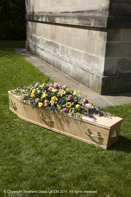 Colourful casket spray